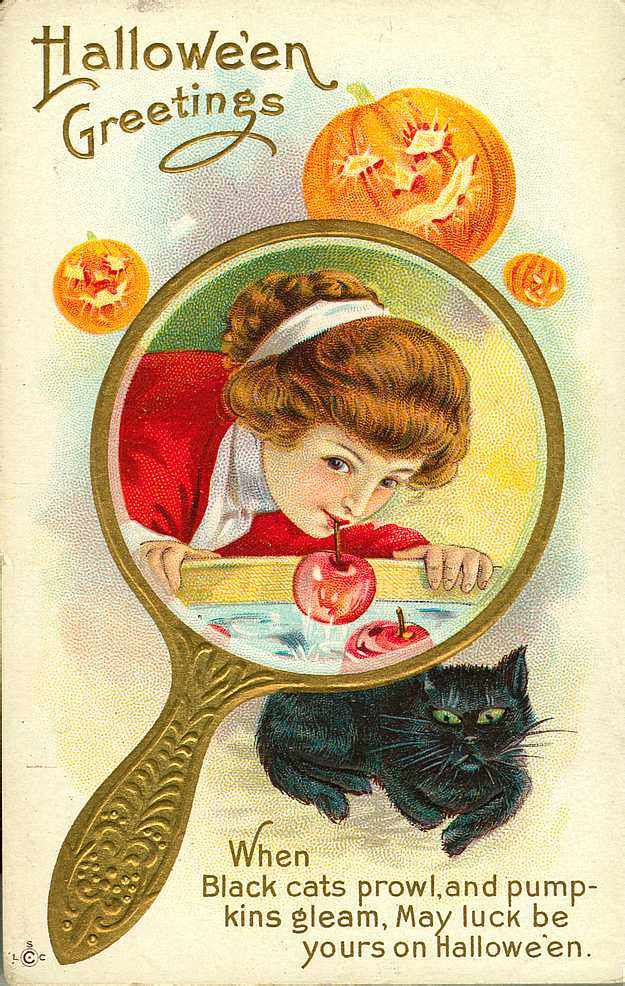 Hallowe'en Greetings: a girl in a hand mirror with a black cat, Early 1900s — vintage postcard