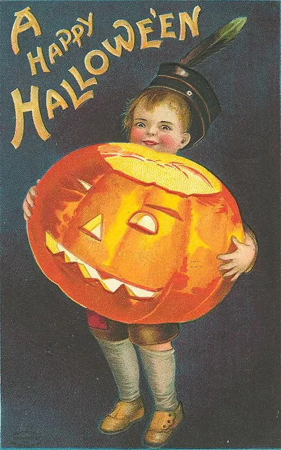 A Happy Hallowe'en: a child carrying a jack-o'-lantern