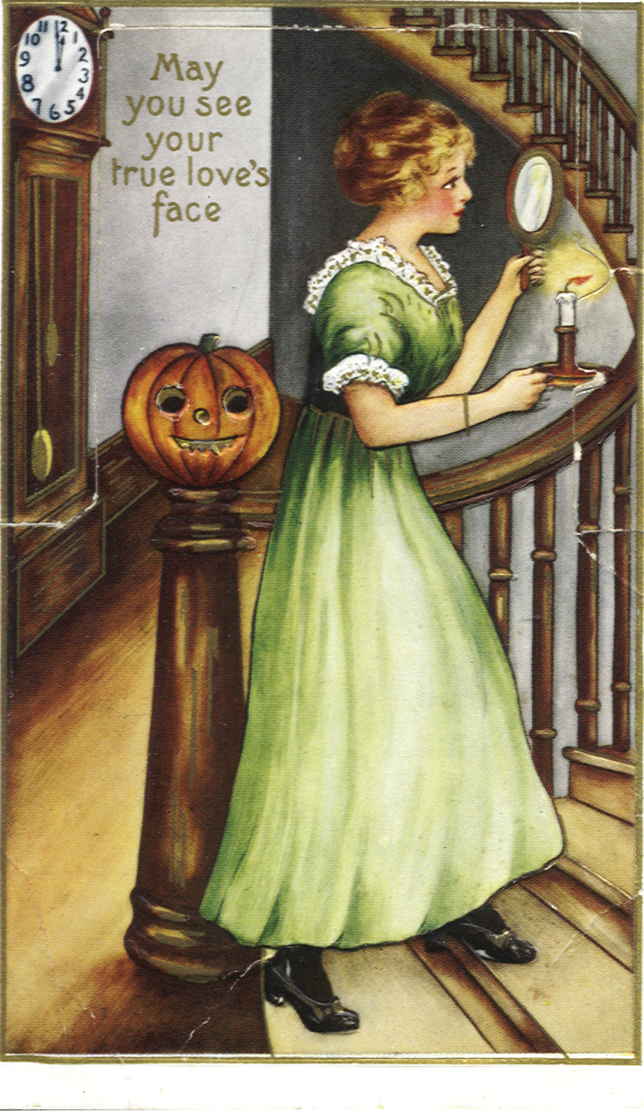 May You See Your True Love's Face: Halloween postcard of a woman with a mirror and candle on the stairs — vintage postcard