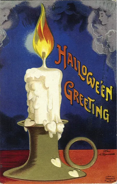 Hallowe'en Greeting postcard with a lit candle