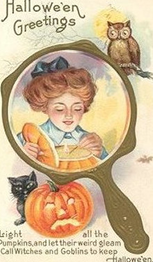 Hallowe'en Greetings: a girl in a hand mirror with an owl and pumpkin, Early 1900s — vintage postcard