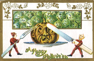 A Happy Hallowe'en greeting card with pumpkin face and cutlery