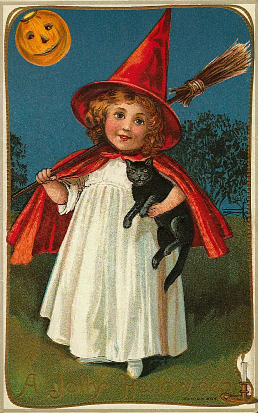A girl in a witch hat and red cape holding a black cat, Early 1900s — vintage postcard