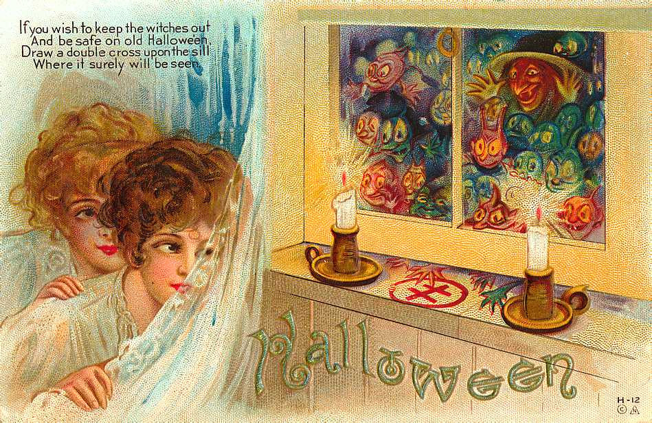 Halloween: a woman at a window with candles, Early 1900s — vintage postcard