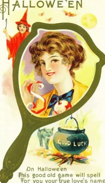 Hallowe'en: a woman in a hand mirror with a Good Luck cauldron