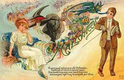 Halloween: a couple and a black cat in the night sky