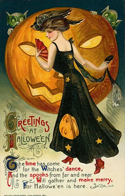 Greetings at Halloween: a woman dancing before a giant jack-o'-lantern
