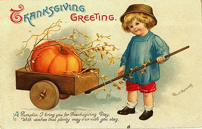 Thanksgiving Greeting: a boy with a pumpkin cart