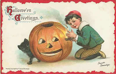 Hallowe'en Greetings: a boy carving a jack-o'-lantern with a black cat