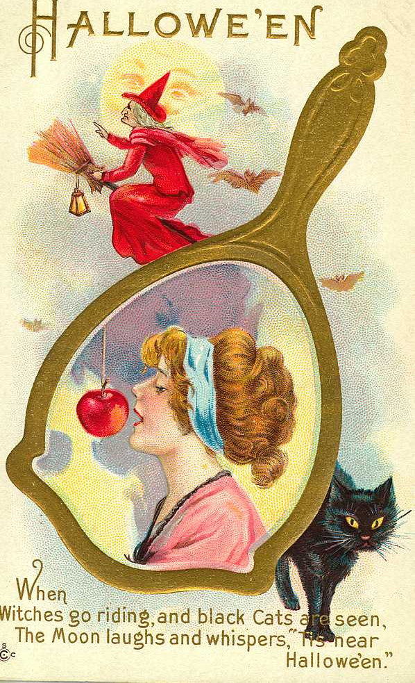 Hallowe'en: a woman in a hand mirror with an apple, Early 1900s — vintage postcard