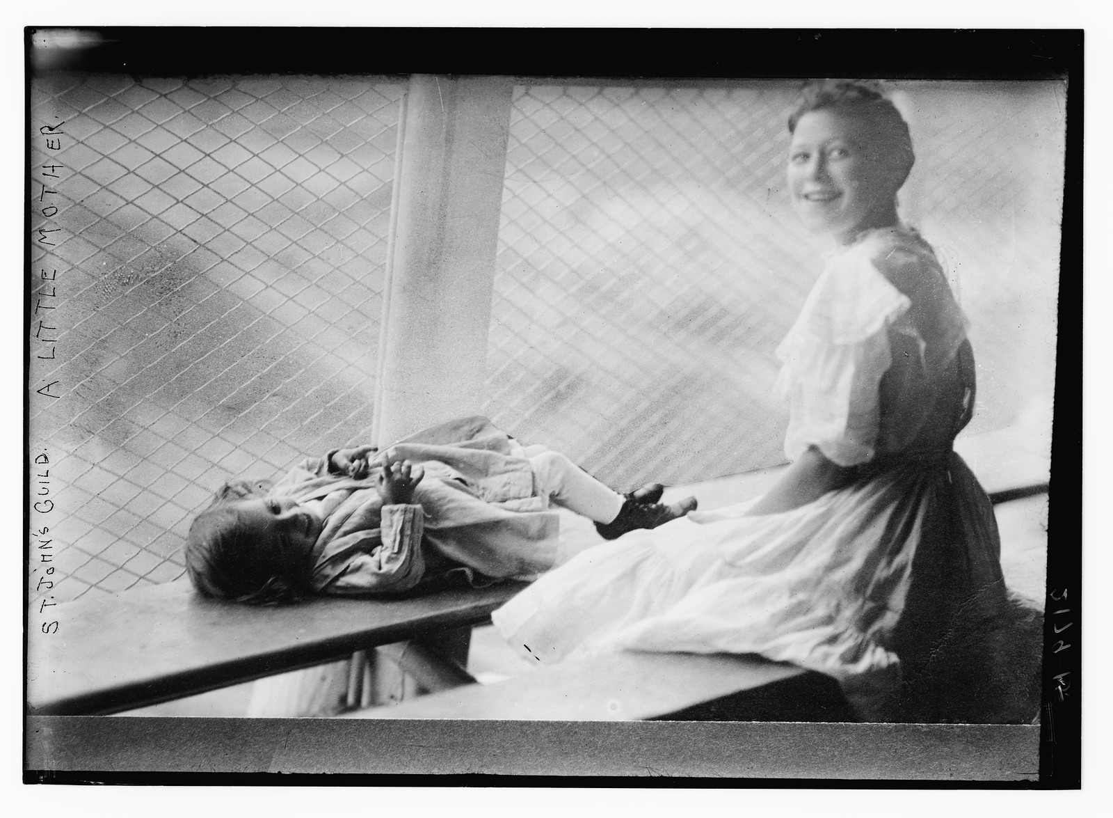 St. John's Guild. A little mother, n/a — historic photograph