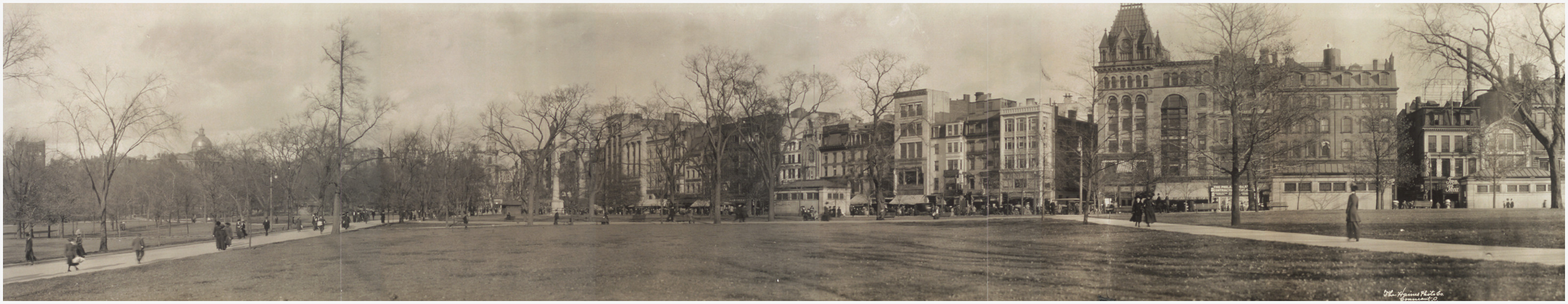 Panoramic photograph of a city park with street buildings, c. 1910, 1910 — historic photograph