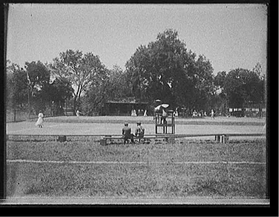 [Outdoor tennis match]