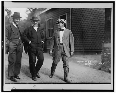 Mr. Thomas Edison walking in laboratory yard with Messrs. Miller Reese Hutchinson and Miller