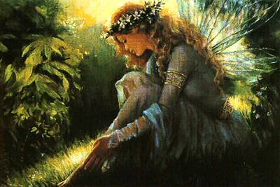 Winged fairy with flower crown resting in grass