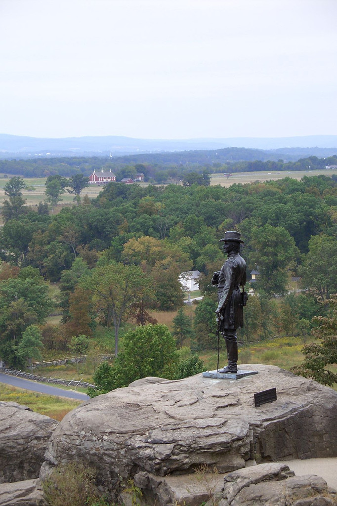 Bronze Union soldier statue on rock overlooking Gettysburg battlefield — historic image