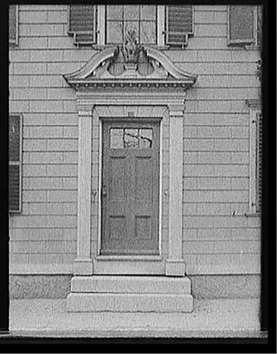 [Doorway with broken pediment surmounted by pineapple, probably Salem, Mass.]