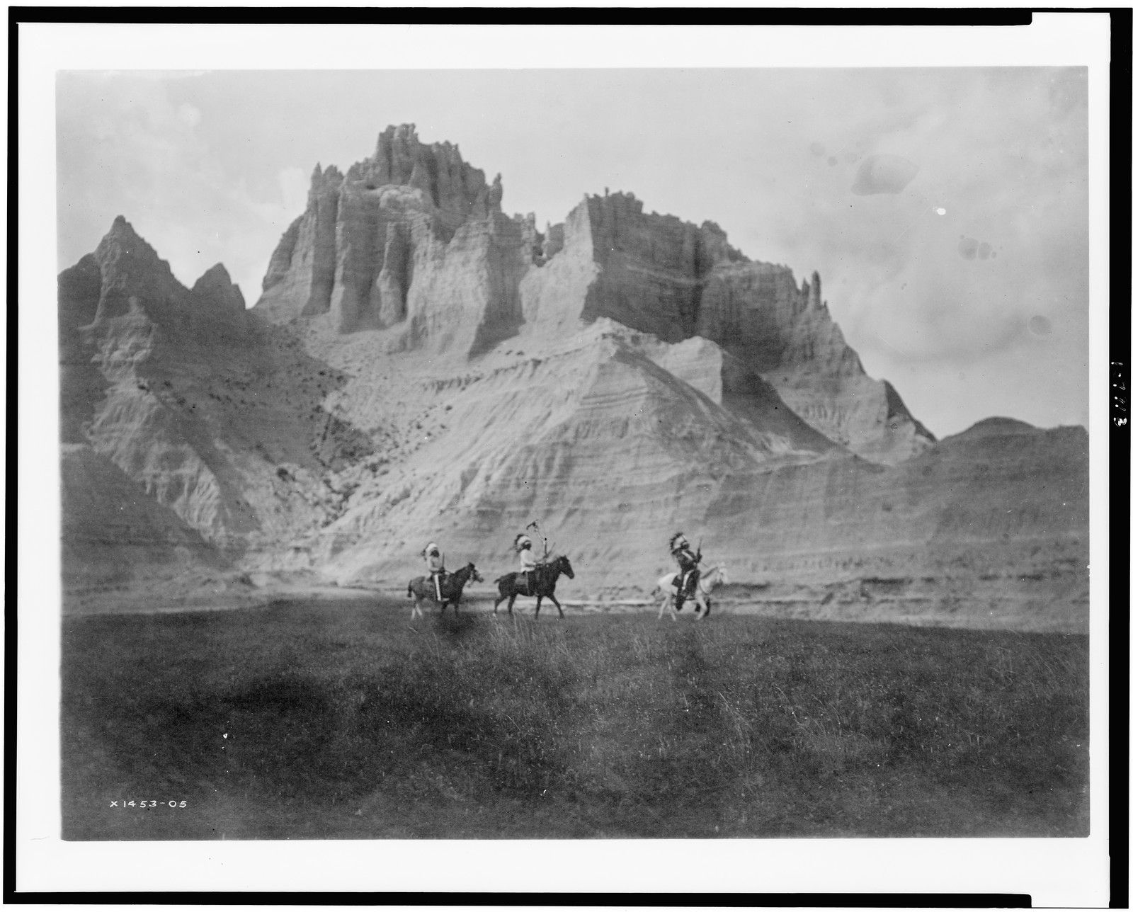 [Entering the Bad Lands. Three Sioux Indians on horseback], c1905. — historic photograph