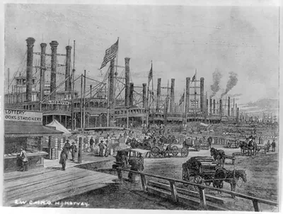 [A long line of steamboats drawn up at New Orleans' waterfront]
