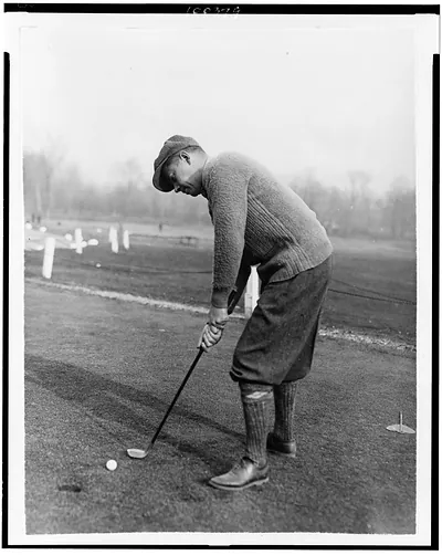 [Reinald Werrenrath, American operatic baritone, putting golf ball]