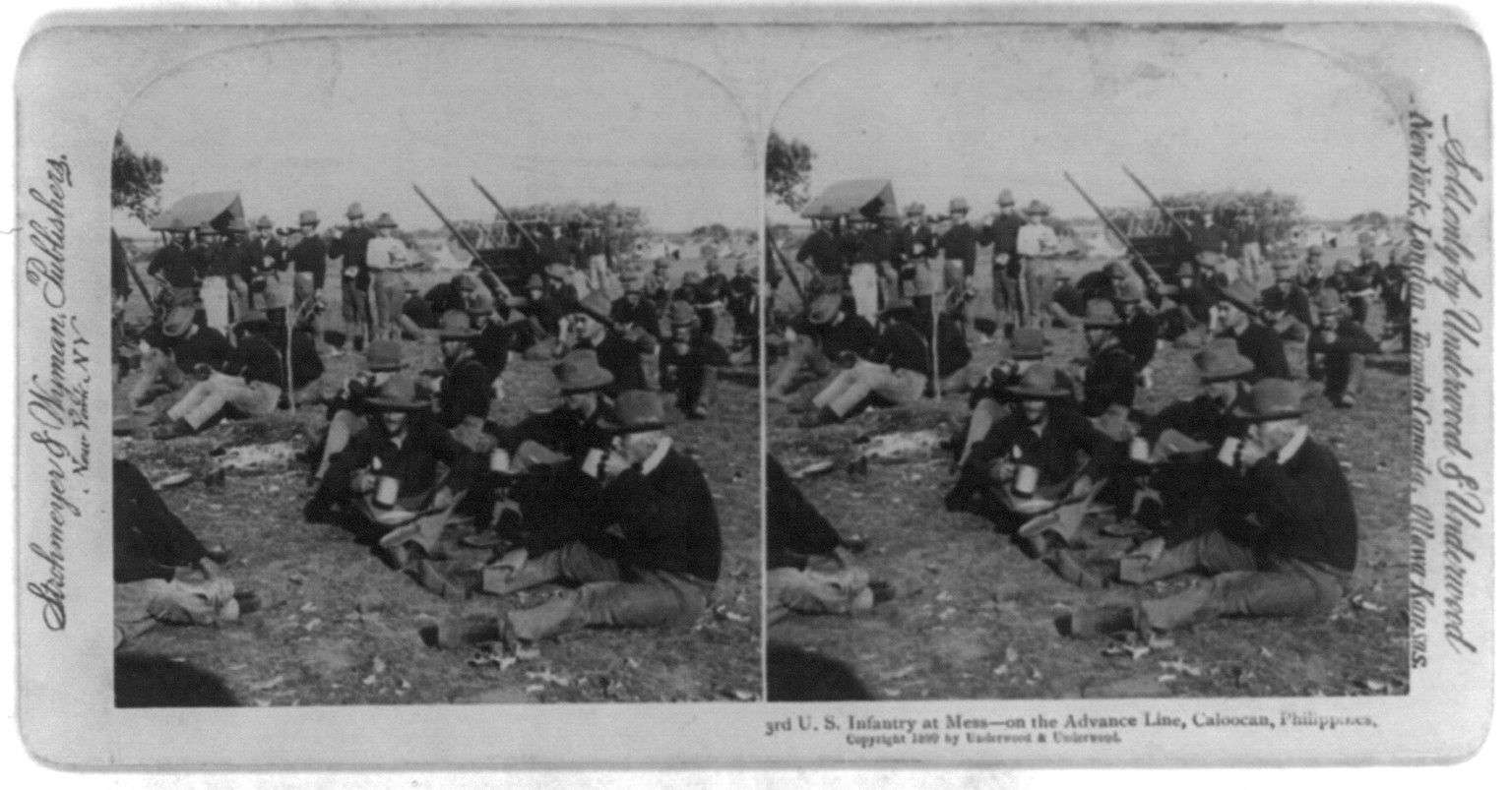 Caloocan, Philippine Islands: U.S. Infantry at mess - on the advance line, c1899. — historic photograph