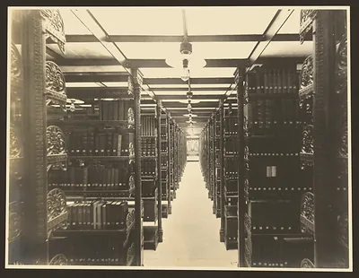 Cast-iron library stacks in a bookroom aisle