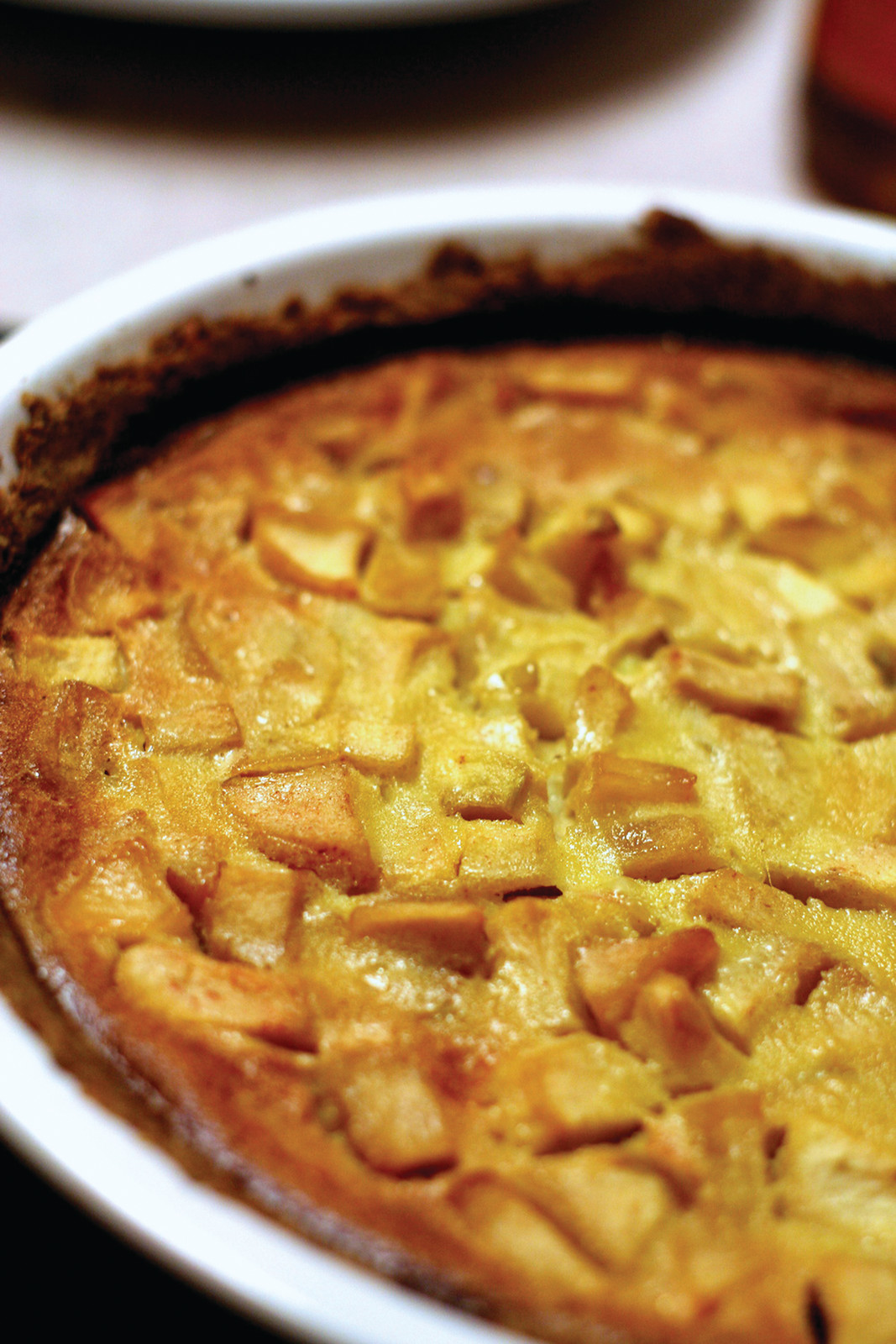 Baked apple tart in a white dish — historic image