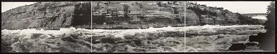 Panoramic photograph of rapids below gorge cliffs