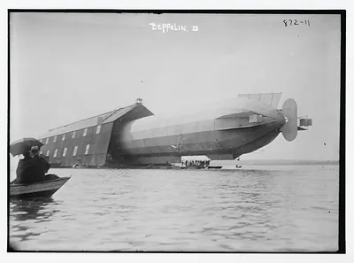 Blimp, Zeppelin No. 3, in shed, seen from water