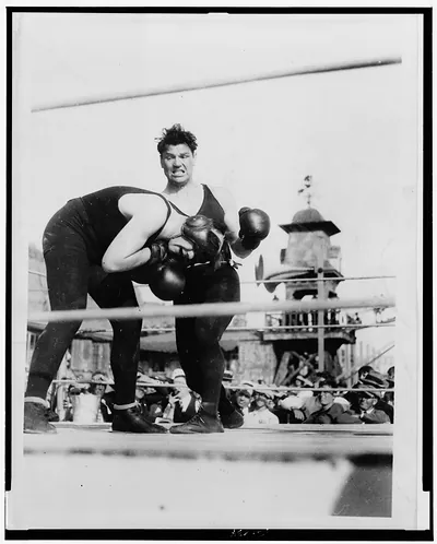 [Jack Dempsey slugging Tony Fuente during a benefit match for the Mississippi Flood Fund in Santa Monica, California]