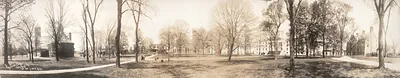 Panoramic sepia photograph of a college campus lawn