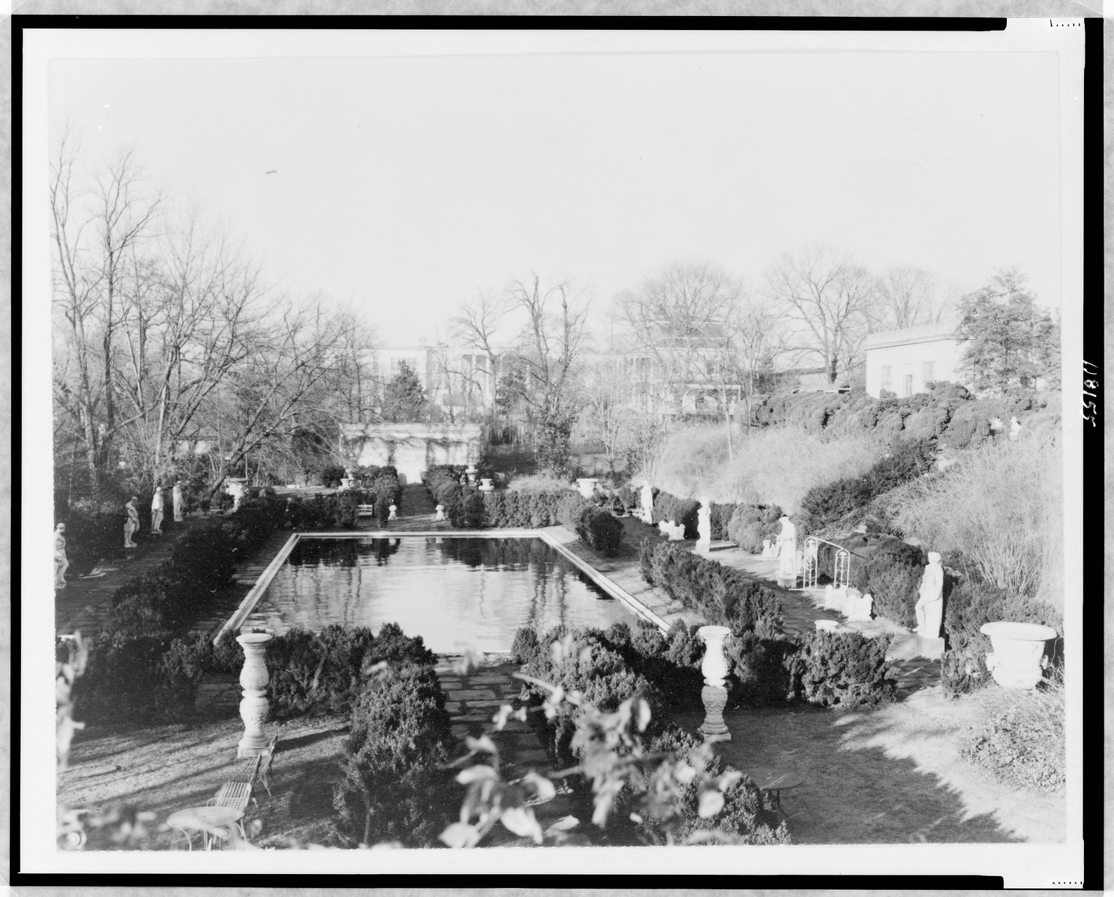 [View of garden, with pool and statues, and house in background, on estate of Evalyn Walsh McLean], [between 1920 and 1950] — historic photograph