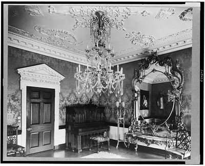 [Marsden J. Perry home, Providence, Rhode Island. Interior scene, detail of piano, crystal chandelier, mirror, and door]