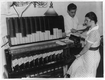 [Machines being used in automobile travel analysis at federal agency in Wash., D.C.: Miss Elizabeth Woodward and E.T. Potterson using sorting machine]