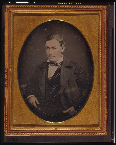 [Unidentified man, half-length portrait, facing left]