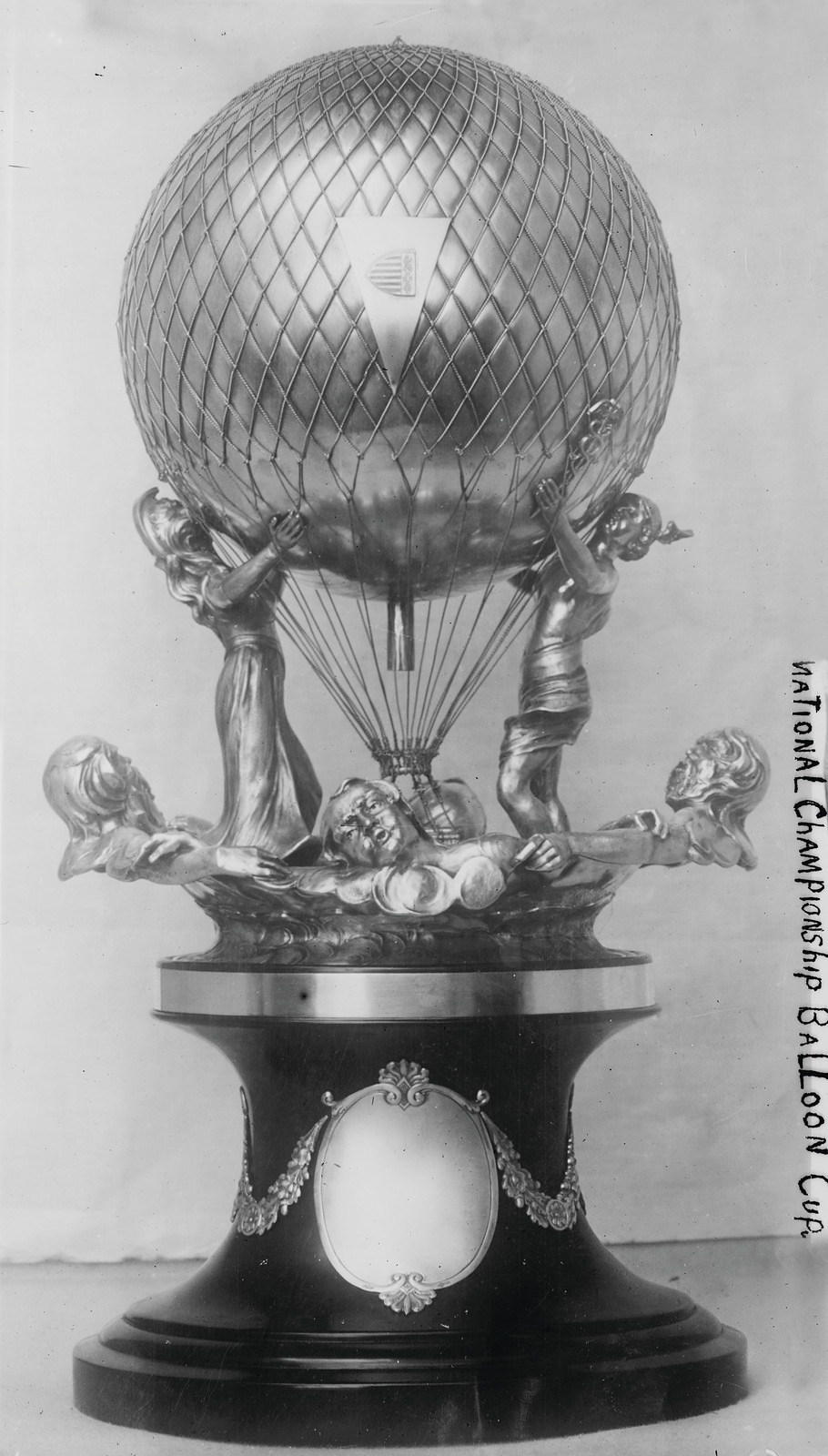Silver balloon-shaped trophy cup with handwritten National Championship Balloon Cup label — historic image