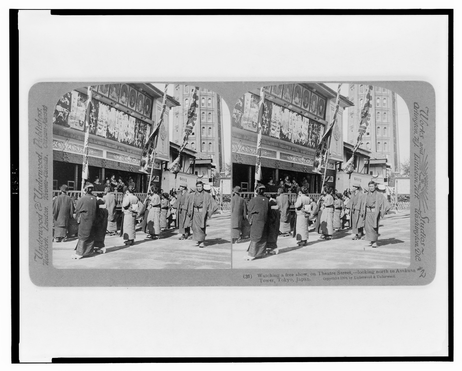 Watching a free show, on Theatre Street, looking north to Asakusa Tower, Tokyo, Japan, New York ; London ; Toronto-Canada ; Ottawa-Kansas : Underwood & Underwood, Publishers, c1904 December 30. — historic photograph
