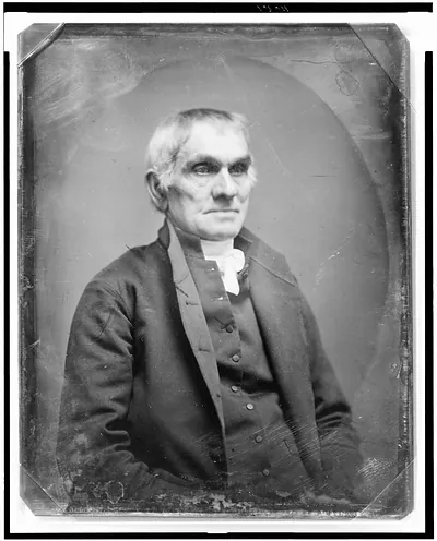 Portrait of an older man in a dark coat, half-length
