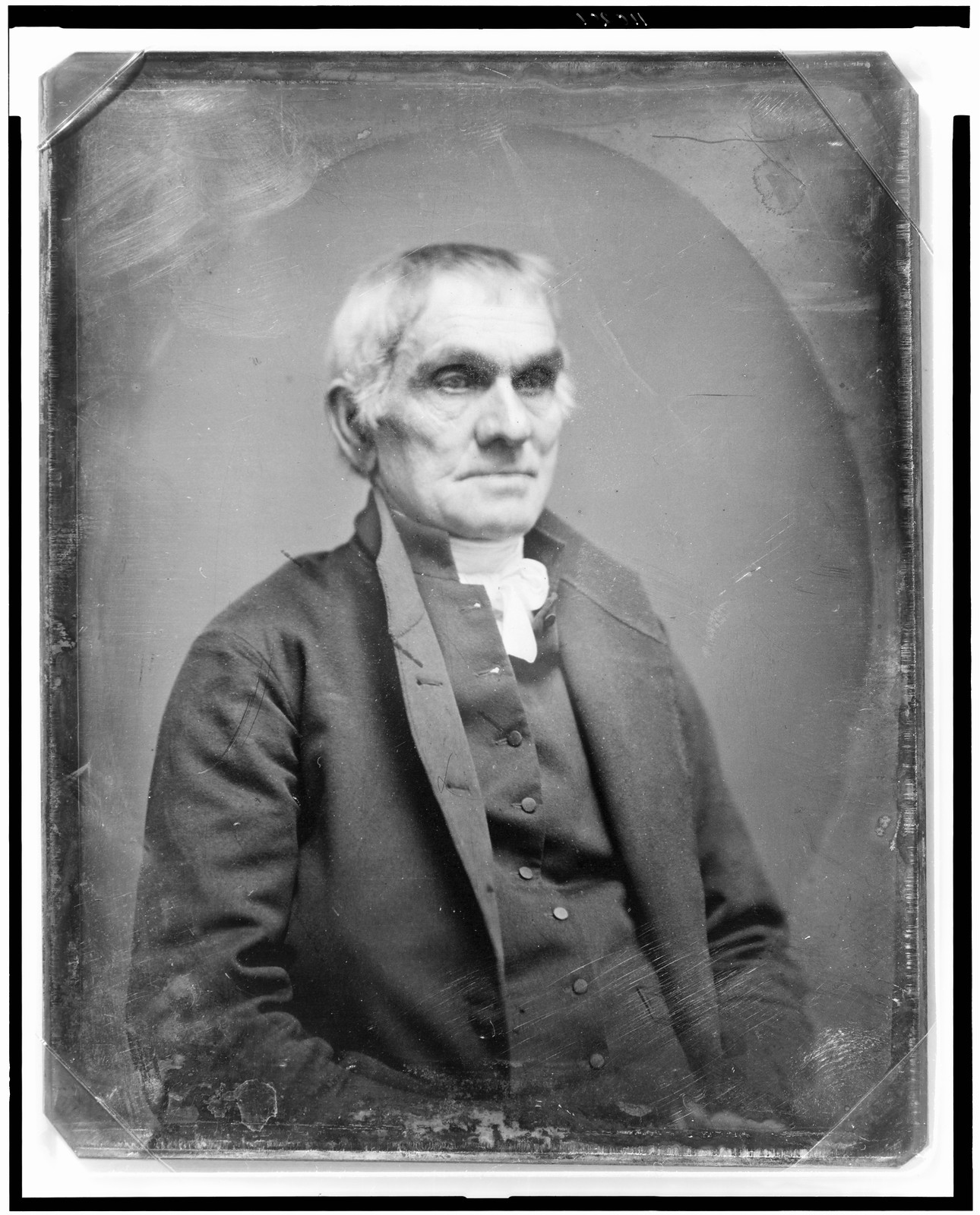 Portrait of an older man in a dark coat, half-length, 1844 — historic photograph