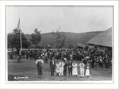 [County or state fair in New England: large group outside fair building]