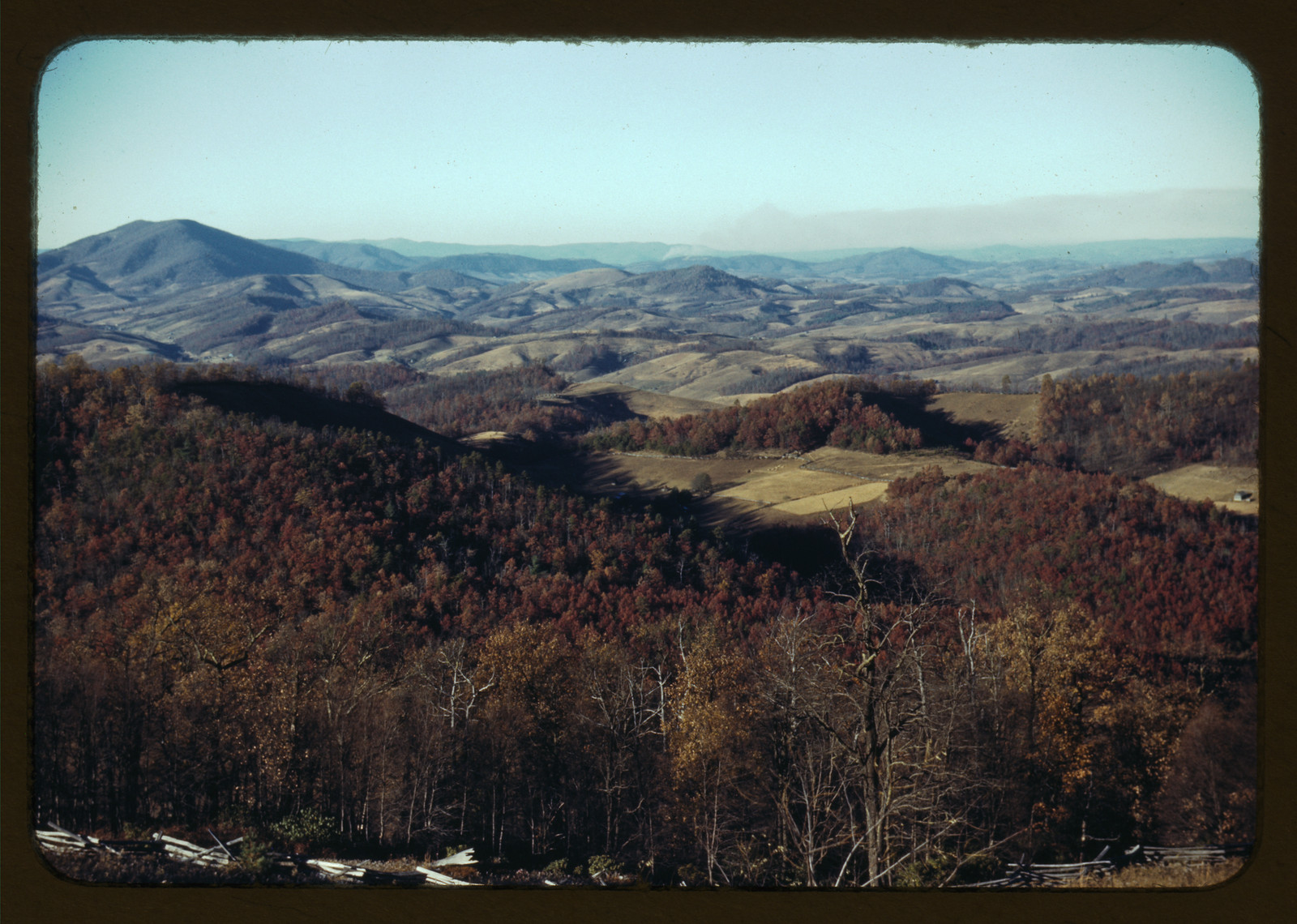 Autumn forested mountain ridges and valley farmland — historic image
