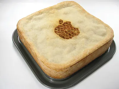 Square apple pie with lattice-cut top on tray