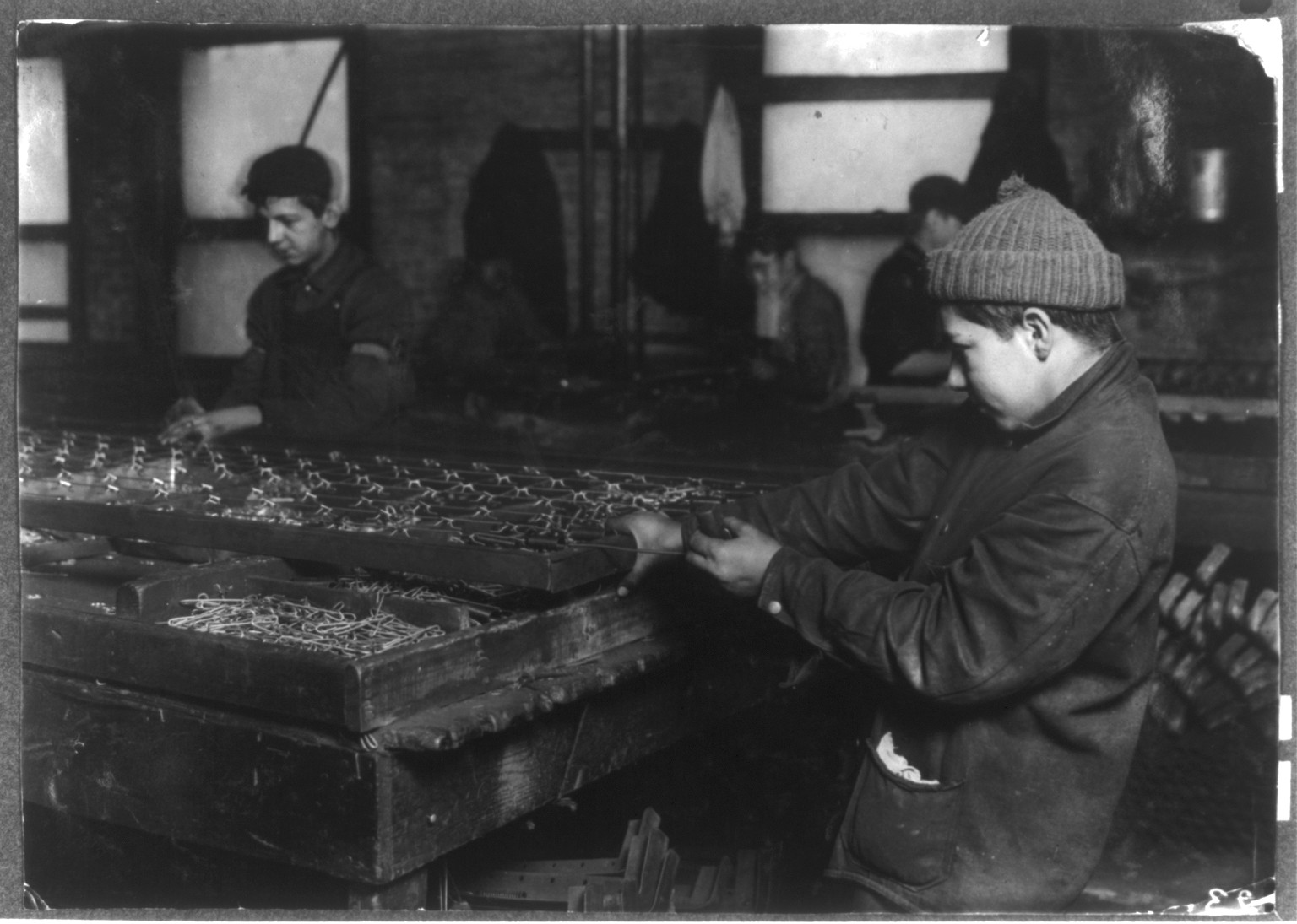 Black & White Photo - Boston - Boys linking bed-springs — historic image