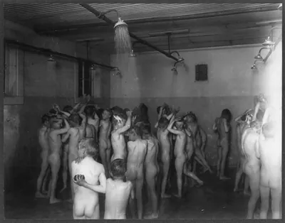 [Denver, Colo., ca. 1910-192_: large group of boys taking shower in reform school]
