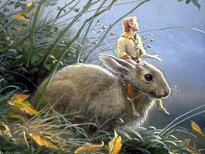 Golden-haired boy in yellow riding a large rabbit through grass