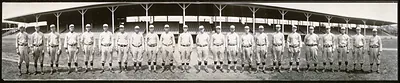 Baseball team posed in front of a grandstand, panoramic photograph