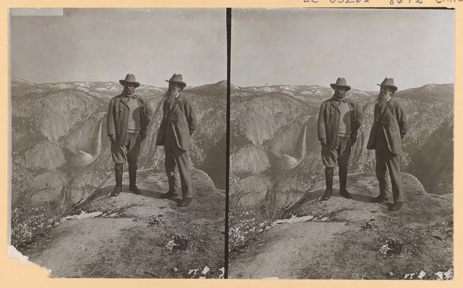 Two men on a rocky overlook above Yosemite Valley, stereo photograph — historic photograph