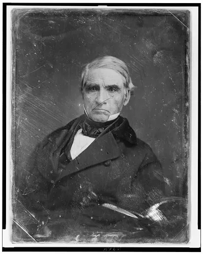 Portrait of an older man in a dark coat