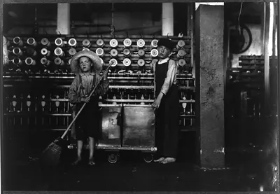 Ronald Webb, twelve year old doffer boy and Frank Robinson, seven year old who helps sweep and doff. Father is cardroom boss, Roanoke (Va.) Cotton Mills. Location: Roanoke, Virginia.