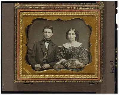 Seated man and woman in daguerreotype portrait case